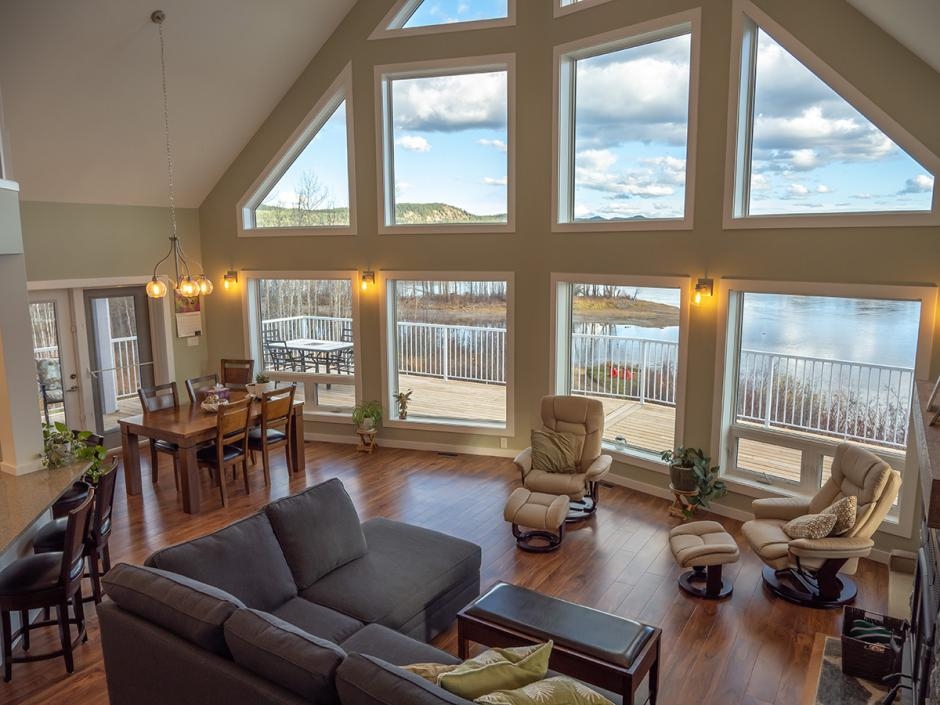 view from living room towards the prow rake wall overlooking a lake